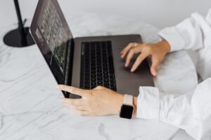 A small business owner reviewing a security monitoring report with an IT provider